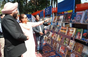 ⁠Governor observing the book gallery set up during Vasantotsav at Raj Bhawan.