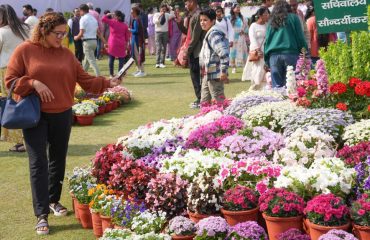 People enjoying the flower exhibition set up during Vasantotsav at Raj Bhawan.