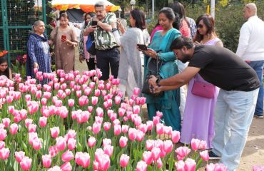 People enjoying the flower exhibition set up during Vasantotsav at Raj Bhawan.