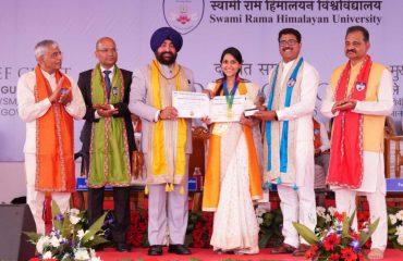 Governor presenting medals and degrees to students at the 7th convocation of Swami Ram Himalayan University.