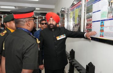 Governor being apprised by the officers of the battalion on the Platinum Jubilee celebrations of 14 Dogra Battalion.
