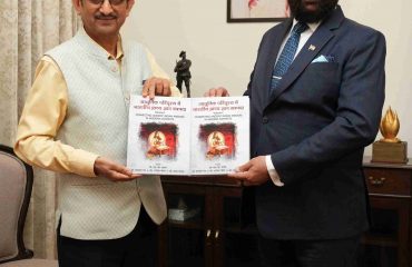 Vice Chancellor of Shridev Suman Uttarakhand University, Prof. N. K. Joshi presenting the book 'Indian Oriental Knowledge Tradition in Modern Scenario' to the Governor.