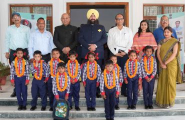 Governor interacting with children taking admission in schools on the occasion of the programme.
