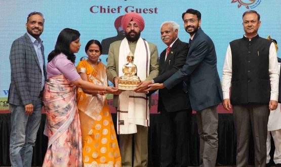 Padma Shri Dr. B.K.S. Sanjay presenting a memento to the Governor at the Road Safety Seminar organised at Raj Bhawan.
