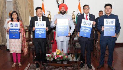 Governor releasing the book "Industry 5.0: Bridging Humanity and Technology for a Sustainable Future" at Raj Bhawan.