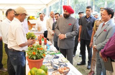 Governor observing the exhibition of beekeeping products in Rajbhawan premises on the occasion of World Bee Day.