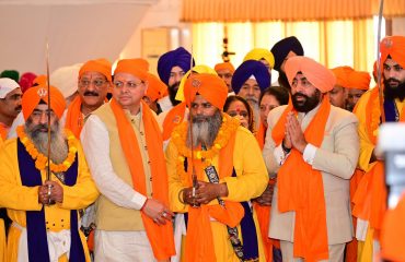 Governor and Chief Minister flagging off the first batch going for Shri Hemkunt Sahib Yatra from Rishikesh under the leadership of Panj Pyaras.
