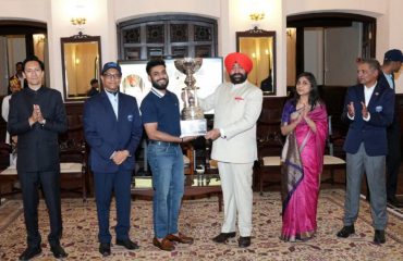 Governor awarding the winners and runners-up of various categories in the 