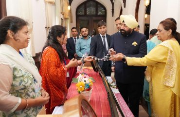 Governor observing the product exhibition organized by women self-help groups at Raj Bhawan Nainital.