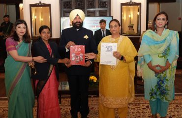 ⁠ ⁠CDO Anamika presenting the book “Ujale Ki Or Badhte Kadam” to the Governor.