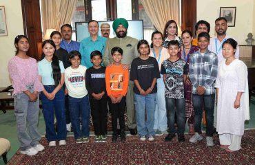 Governor with the children of SOS Bal Gram, Bhimtal at Raj Bhawan.