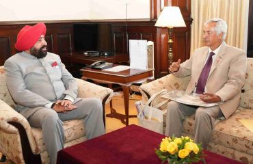 Famous cinematographer and nature lover Padma Shri Anup Shah talking to the Governor.