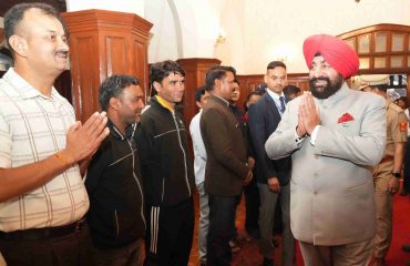 Governor meeting personnel and their families in the Parivar Milan program organized at Raj Bhawan Nainital.