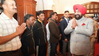 Governor meeting personnel and their families in the Parivar Milan program organized at Raj Bhawan Nainital.