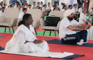 President Draupadi Murmu along with Governor Lt Gen Gurmit Singh (Retd) practicing yoga on the occasion of 11th International Yoga Day at Police Line Dehradun.