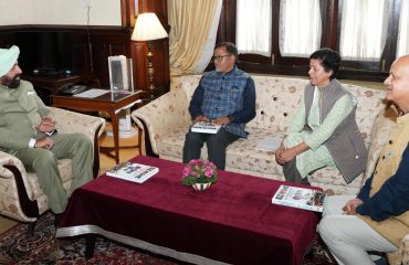 Governor releasing the book “Role of Women in Post-Independence Uttarakhand” written by Prof. Savitri Kaida Jantwal.