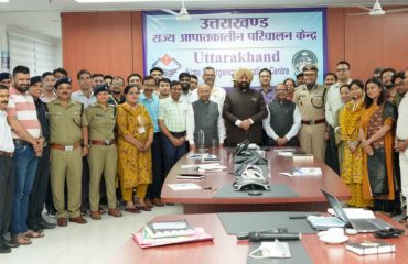Governor with officers and employees at Uttarakhand State Emergency Operations Center.