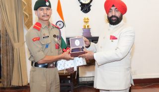 Governor honoring NCC cadets who conquered Mount Everest at a program organized at Raj Bhawan.