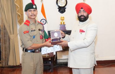 Governor honoring NCC cadets who conquered Mount Everest at a program organized at Raj Bhawan.
