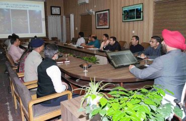 Governor taking a detailed briefing from district administration officials about the disaster at the Collectorate.