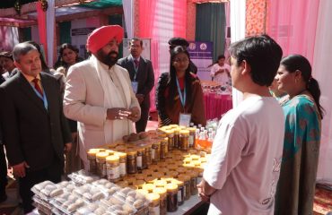 The Governor inspecting and gathering information from an exhibition organized by self-help groups on the occasion of the inauguration of a two-day Chintan Shivir at the Forestry College, Ranichauri.