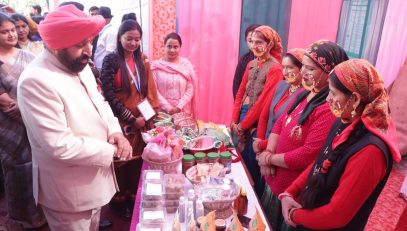 The Governor inspecting and gathering information from an exhibition organized by self-help groups on the occasion of the inauguration of a two-day Chintan Shivir at the Forestry College, Ranichauri.