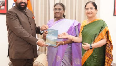 Governor presenting the book “Mountains of Labour; Currents of Change – Women's Livelihood and Economic Transitions in the Himalayan Region and Uttarakhand” to the President.