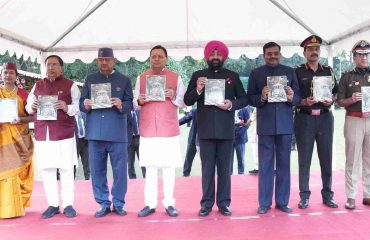 Governor and Chief Minister releasing books of the State Information Commission at the function.