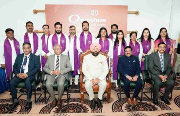 Governor with students receiving medals and degrees