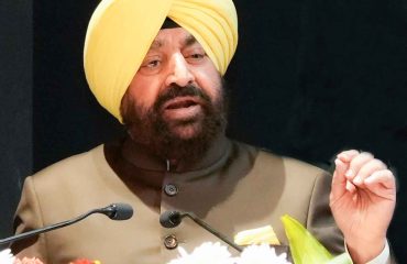 Governor addressing the book launch program Pushkar Dhami: The Vibrant Heat of the Himalayas at Raj Bhawan.