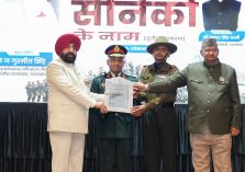 The Governor presenting a certificate of appreciation to a military officer at the 