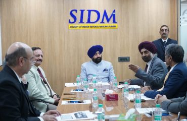 The Governor holding a meeting with officials and representatives of the Society of Indian Defence Manufacturers (SIDM) during his visit to SIDM.