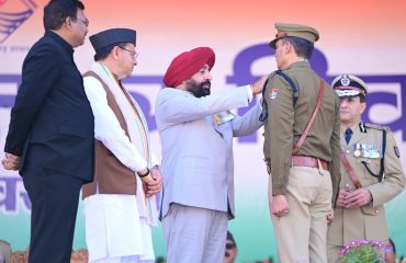 The Governor honoring police officers with medals for distinguished service on Republic Day.