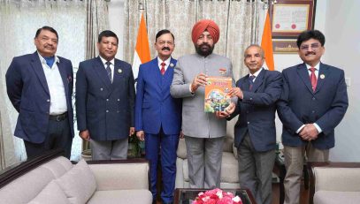 Officials of the PPS (Retired) Officers Welfare Association Uttarakhand presenting their seventh annual souvenir, 'Shatmukh-2025', to the Governor.