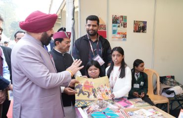 The Governor observing the artworks of children with disabilities