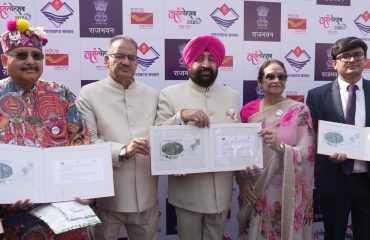 The Governor releasing a special postal cover on the theme of 