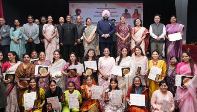 Governor with girls and women at the programme