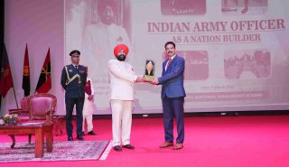 The Governor presenting a memento to the Commandant of the Indian Military Academy, Lieutenant General Nagendra Singh, at the programme on “Indian Military Officers: As Nation Builders” at the Indian Military Academy.