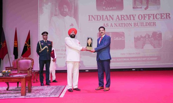 The Governor presenting a memento to the Commandant of the Indian Military Academy, Lieutenant General Nagendra Singh, at the programme on “Indian Military Officers: As Nation Builders” at the Indian Military Academy.