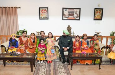 The Governor participating in the program celebrating Uttarakhand's traditional folk festival