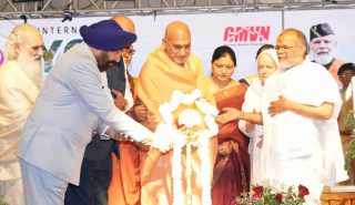 The Governor inaugurating the closing ceremony of the International Yoga Festival-2026, held in Rishikesh, by lighting the ceremonial lamp.