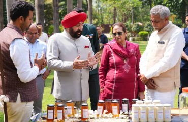 The Governor and the First Lady, Smt. Gurmeet Kaur, observing the honey bee processing