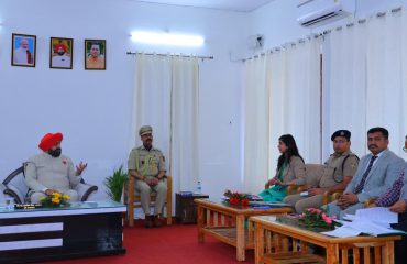 The Governor conducting a review meeting on the district's development works with officials of the District Administration