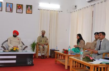 The Governor conducting a review meeting on the district's development works with officials of the District Administration at the Circuit House, Pauri.