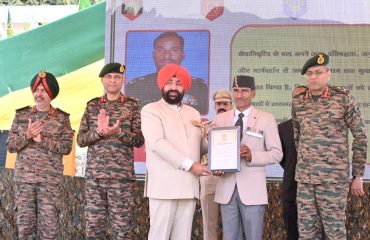 Governor honoring ex-servicemen at the rally of ex-servicemen and a program organized for military families in Pithoragarh.