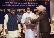 The Governor presenting a shawl and extending birthday wishes to Acharya Lokesh Muni Ji on the occasion of the 