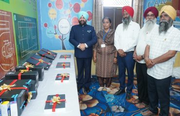 The Governor with the teachers at the Government Senior Secondary School, Jalal Usman, Amritsar, after donating computers and books to enhance the school's facilities.