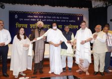 The Governor presenting a shawl and extending birthday wishes to Acharya Lokesh Muni Ji on the occasion of the 