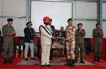 The Governor felicitating soldiers for their outstanding service during the Sainik Sammelan held in Auli, Chamoli.