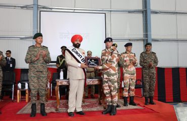 The Governor felicitating soldiers for their outstanding service during the Sainik Sammelan held in Auli, Chamoli.